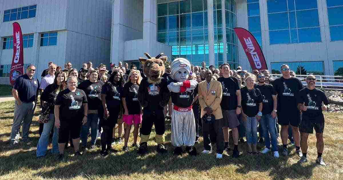 A group gathered in front of the Pro Football Hall of Fame